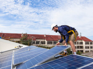 solar panel installers on a roof in marana, az